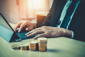 Laptop and coins