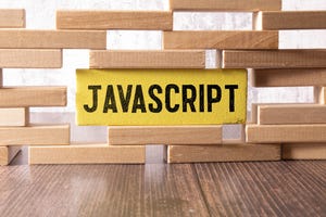 javascript written on building block in wall of wooden blocks