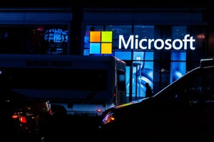 Microsoft logo on building at night