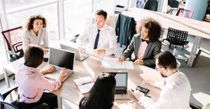 workers collaborating around a table