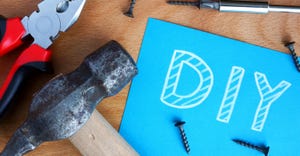 DIY on blue paper surrounded by tools