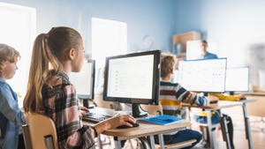 students on computers at their desks