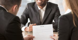 HR managers examining a resume