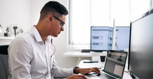 software developer working on his computer